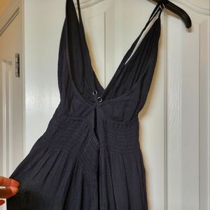 Flowy black maxi dress with deep v neck and criss cross back straps!!